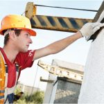 Worker performing exterior painting project